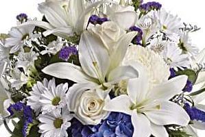 white lily with a touch of blue flowers, perfect for a baby boy. 