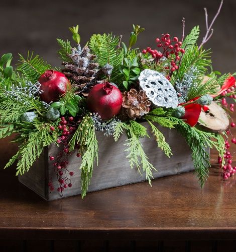 longlasting flowers for chrismas with winter greens and accents for delivery in winnipeg.