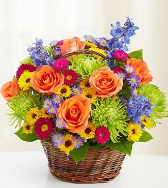 Orange roses with colorful seasonal blooms perfect for Birthday flowers!