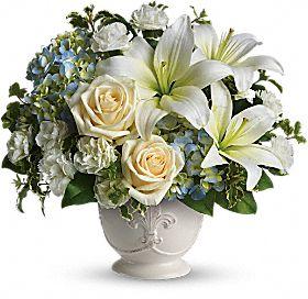 Beautiful dreams white and blue flowers for sympathy delivered by Winnipeg Florist