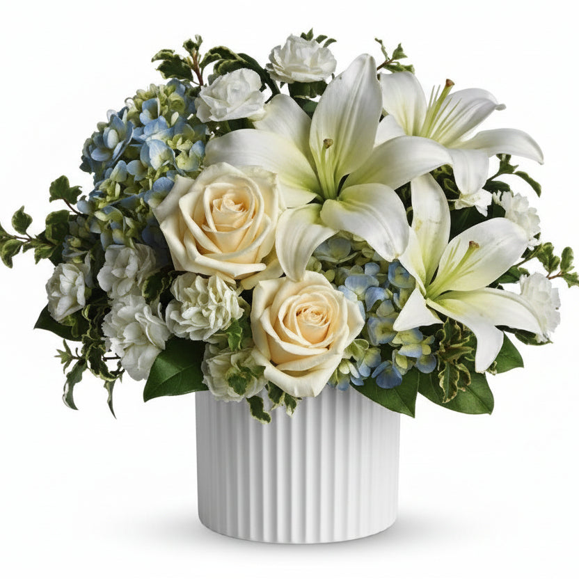 Beautiful dreams white and blue flowers for sympathy delivered by Winnipeg Florist