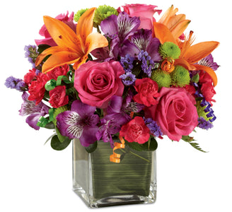 Hot pink roses with orange, green and purple flowers make the perfect Birthday flowers to send. 