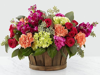 colorful flowers in basket delivered by florist in winnipeg