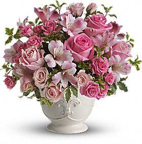 Pink roses and alstromaria designed in white container by local florist-Valley Flowers