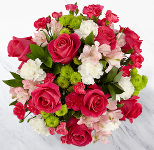 Large bouquet of roses and carnations i Hot pink, Lime green and white with seasonal flowers.