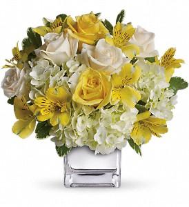 White flower with touches of yellow, created by local florist in Winnipeg. 