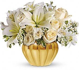 White flowers in metallic container. Tastefully arranged by local florist in Winnipeg-Valley Flowers