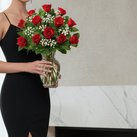 Red rose with babys breath arranged in vase for same day flower delivery in Winnipeg.