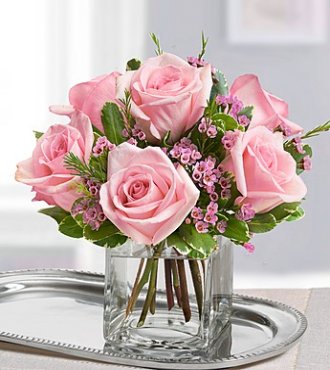 Pink roses in vase available for same day flower delivery in Winnipeg